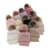 Winterset für Mädchen: Mütze und Schal mit Bommel in Beige Zelta